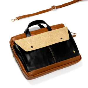 Brown and black vegan leather briefcase with a visible brand logo on a white background
