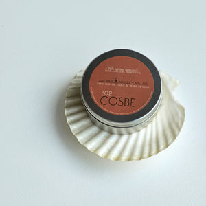 Cosmetic container with 'COSBE' branding on a white background. 