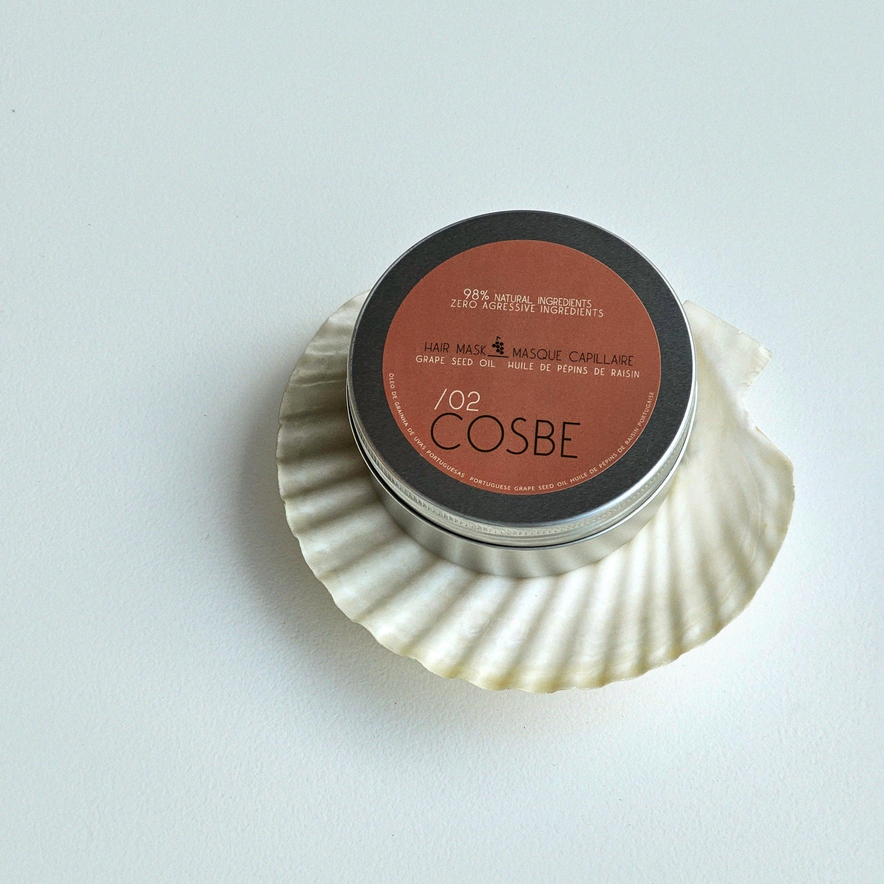 Cosmetic container with 'COSBE' branding on a white background. 