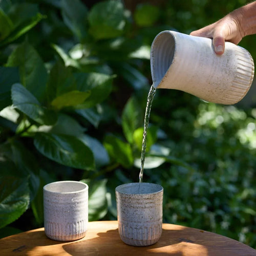 Fluted Carafe Large - Deed Industries shown in use pouring water