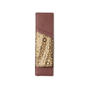 Brown vegan leather pen holder with gold floral pattern on a white background