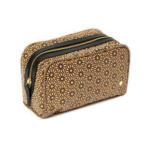 Gold geometric patterned pouch with black zipper on a white background