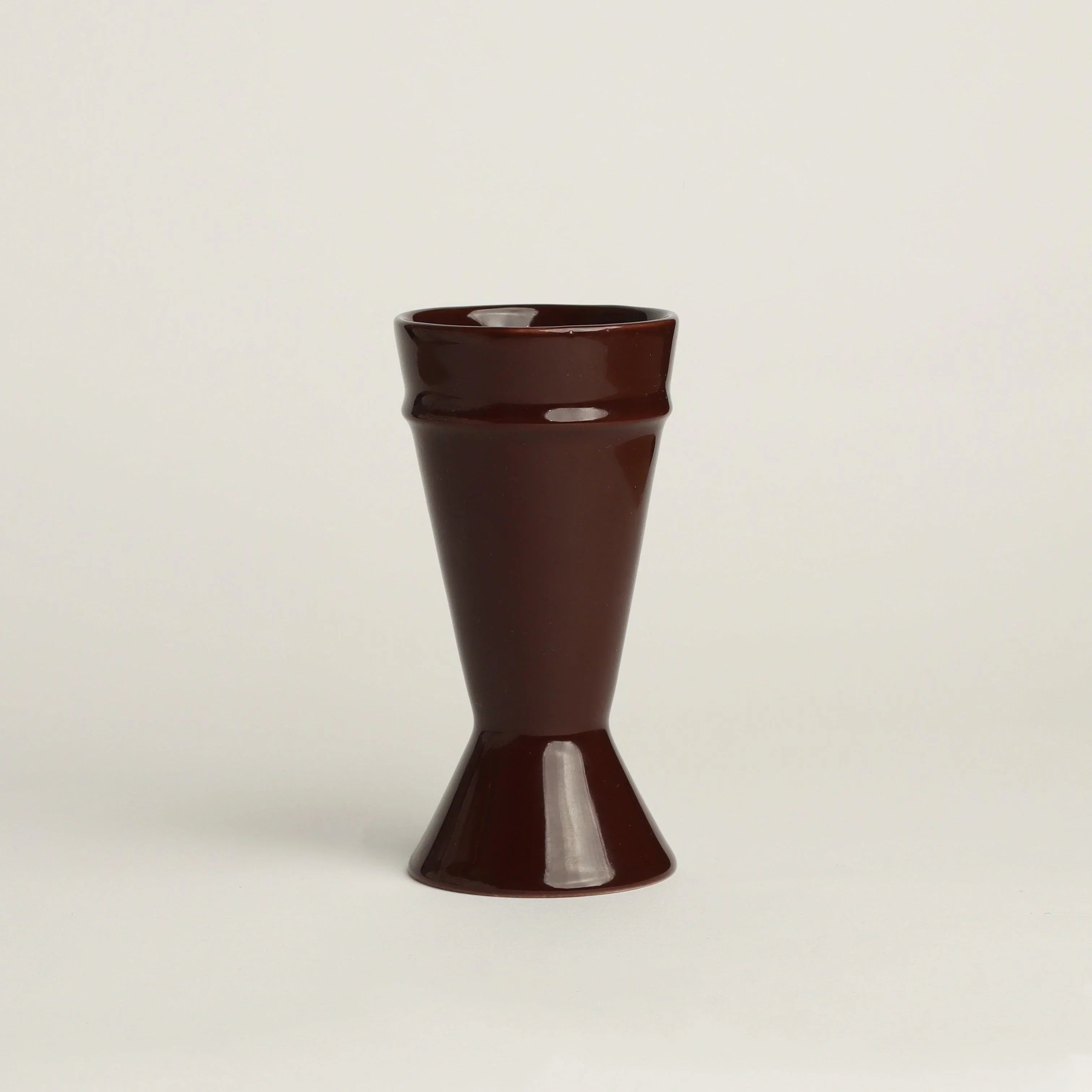 Chocolate coloured Mazagran Coffee Cup made from upcycled clay. White background