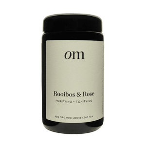 Organic Merchants Rooibos Tea 80g in a black jar against a white background