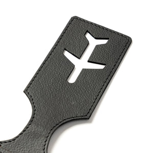 Black vegan leather strap with airplane cutout on a white background