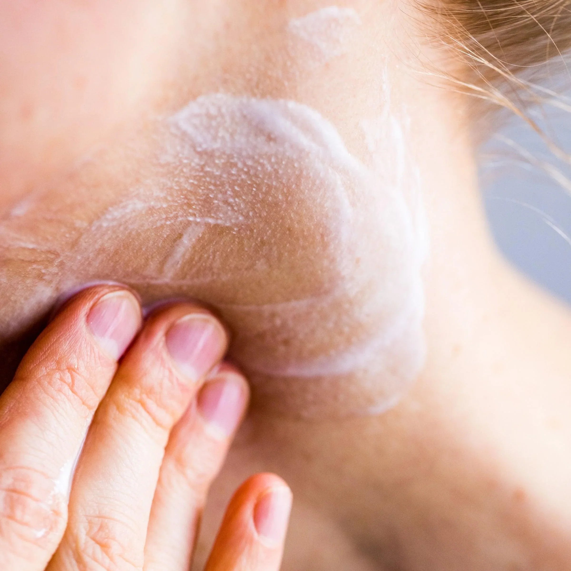 Facial cleansing milk in use