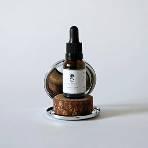 grums restore & glow one ingredient skincare sitting inside a mirrored compact