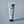 Skincare tube with flowers on a gray background