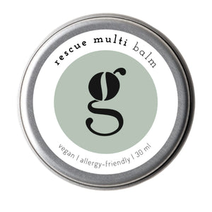 Tin of rescue multi balm with a green label on a white background