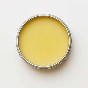 Metal container with yellow substance on a white background