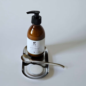 mild facial cleansing milk sitting on a tray