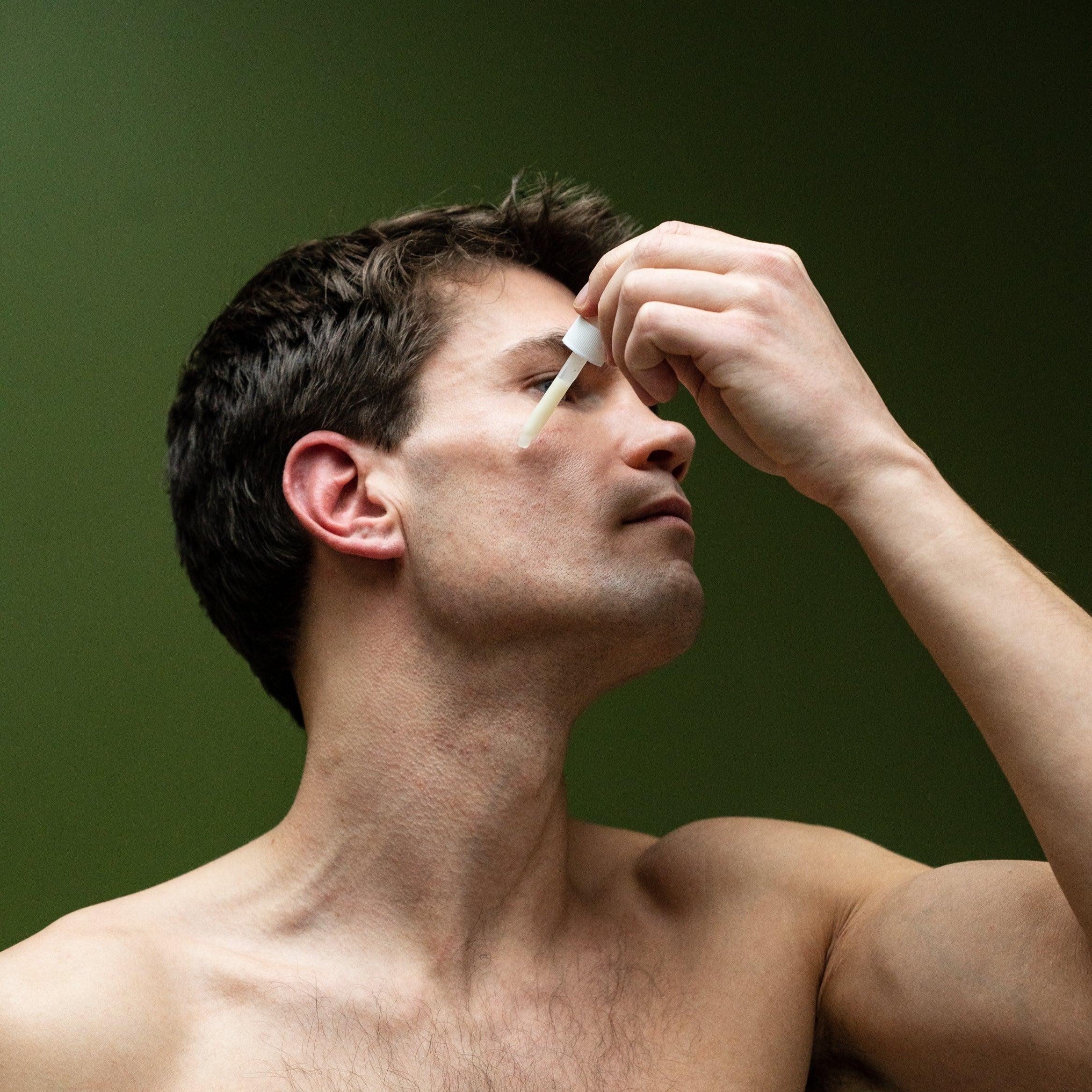 male using grums under eye serum